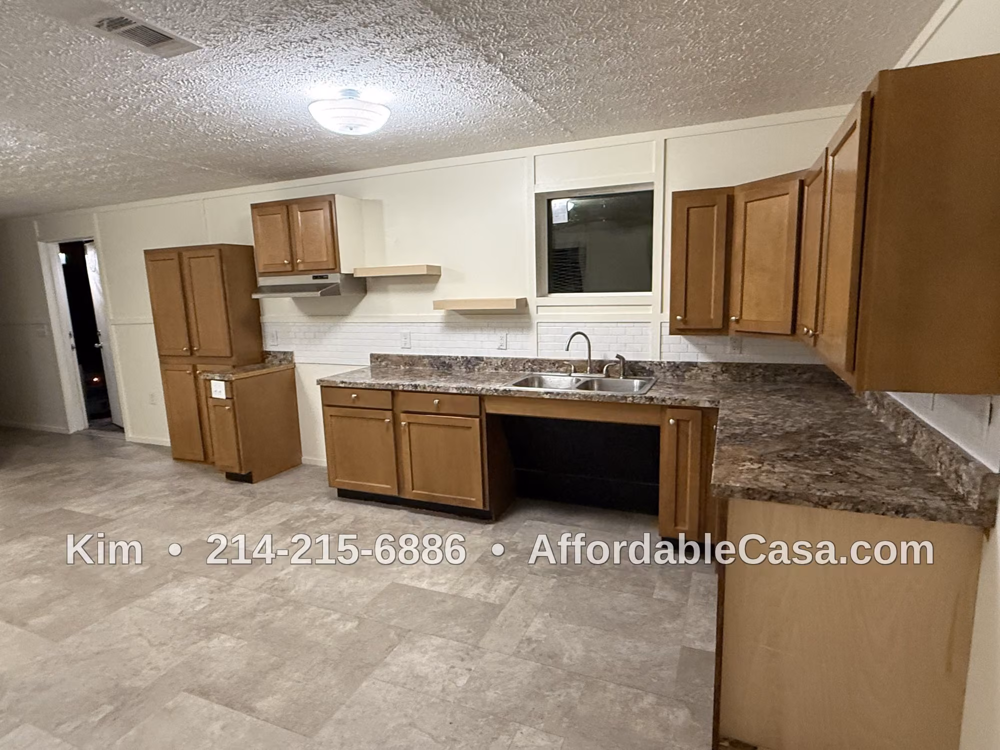 Kitchen with oven and cabinets. Text says "Kim, 214-215-6886, AffordableCasa.com".